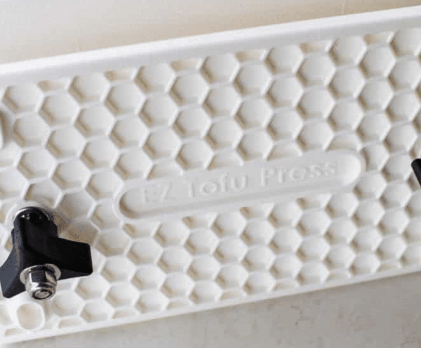 vertical photo of the new improved EZ Tofu Press design.