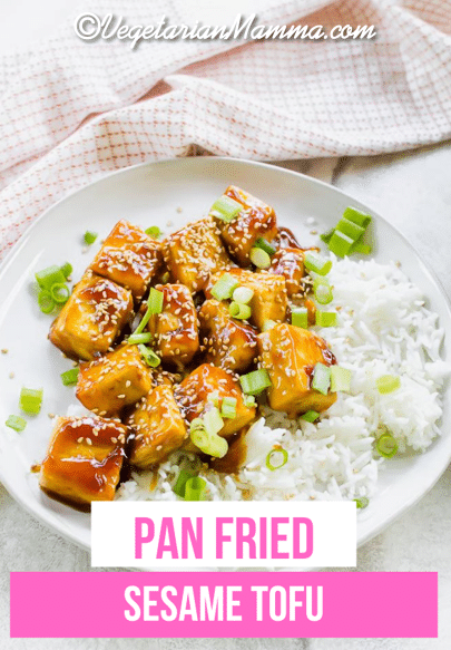 Sesame Tofu is the easiest Asian-inspired vegetarian dish ever! Crispy pan-fried tofu is covered in a soy, honey, and sweet Thai chili sauce and garnished with sesame seeds. #sesametofu #tofu via @vegetarian mamma