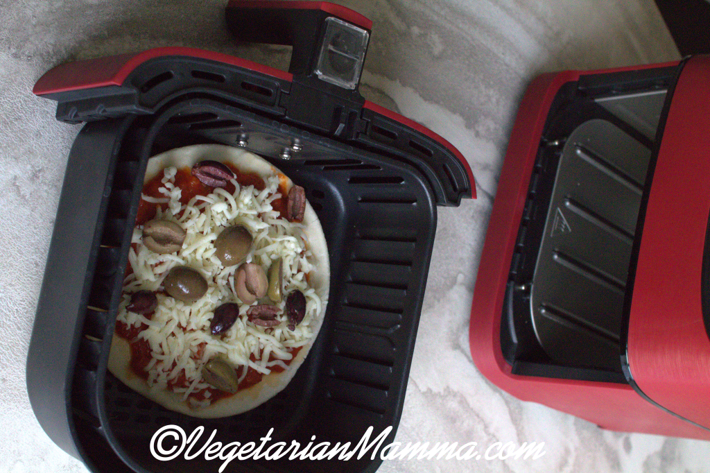 place pizza into air fryer basket.