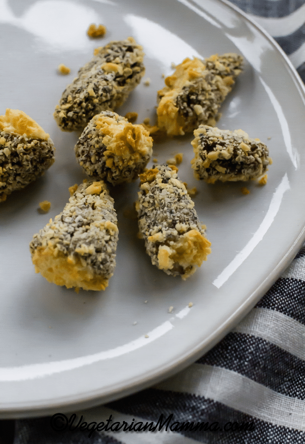 Air Fryer Morel Mushrooms on white plate with a black and white striped napkin on the right