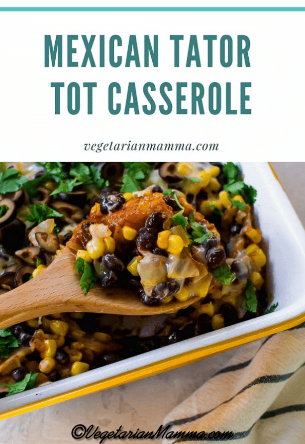 A white pan of Mexican tator tot casserole with a spoon full of the casserole.