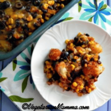 A white plate full of mexican tator tot casserole.