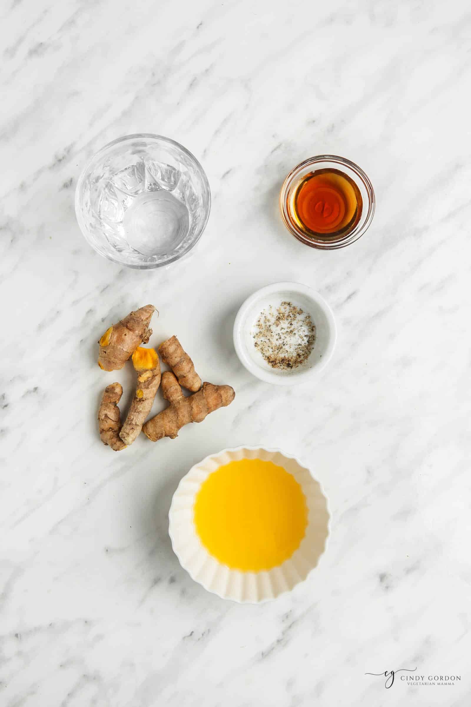 Overhead shot of the 5 ingredients in turmeric shots