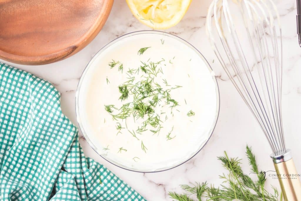 top down view of a glass bowl filled with tartar sauce