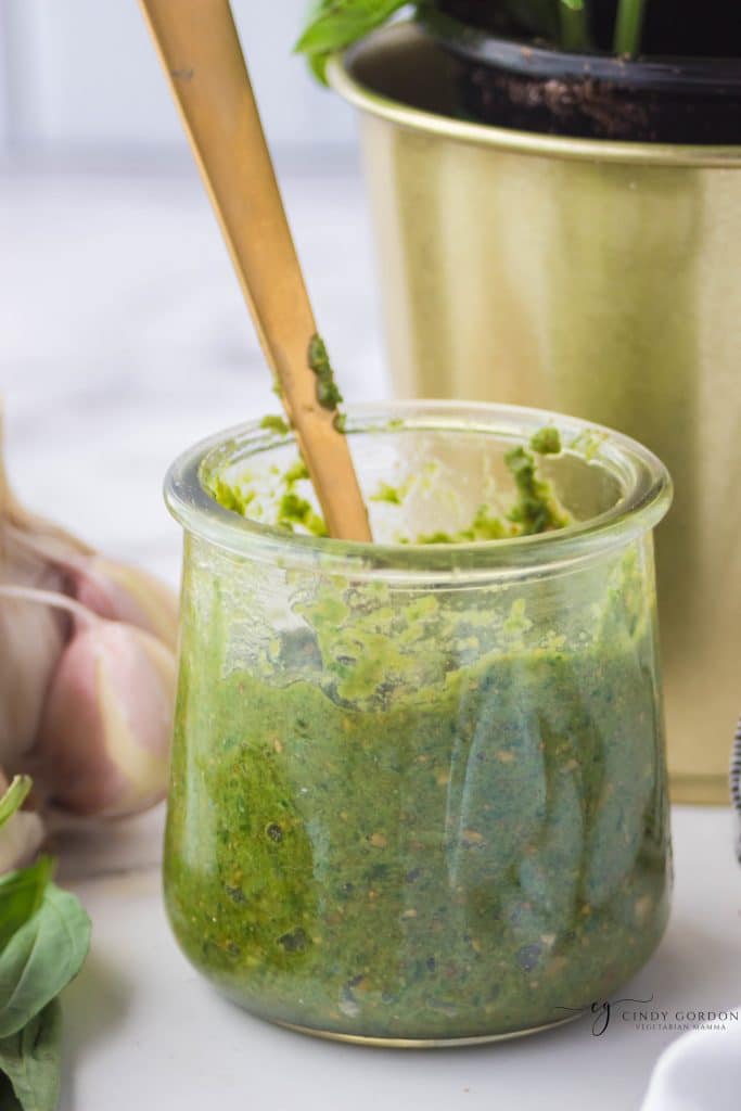 a small glass jar filled with sunflower seed nut free pesto