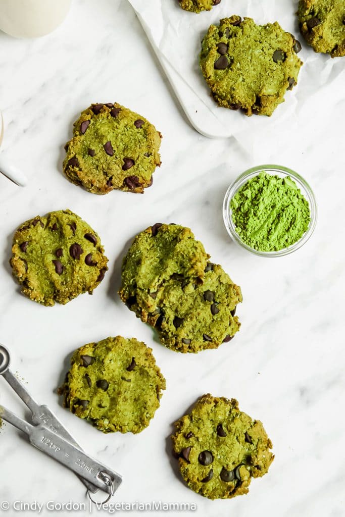 Green matcha chocolate chip cookies on a marble counter top