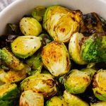 Air Fryer Brussel Sprouts inside of white bowl close up