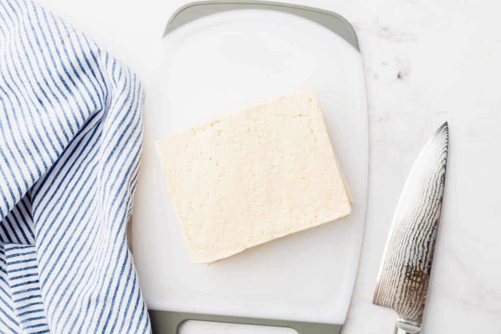 tofu block on cutting board
