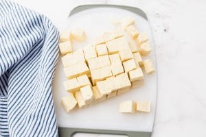 diced tofu cubes on cutting board