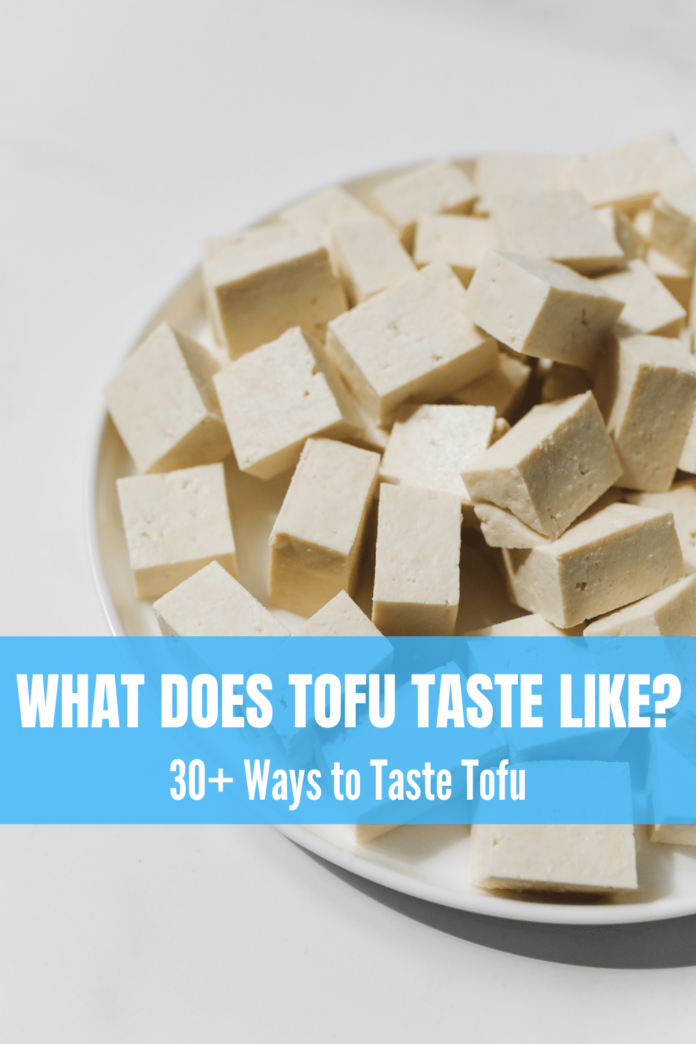 text overlay saying WHAT DOES TOFU TASTE LIKE? over top of raw tofu