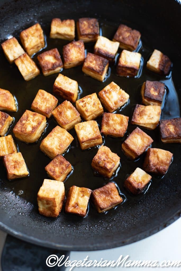cubed tofu sautéed in a pan