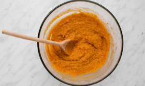 In a large mixing bowl, beat together the mashed sweet potato, almond butter, vegan butter, maple syrup, vanilla extract, and almond milk.