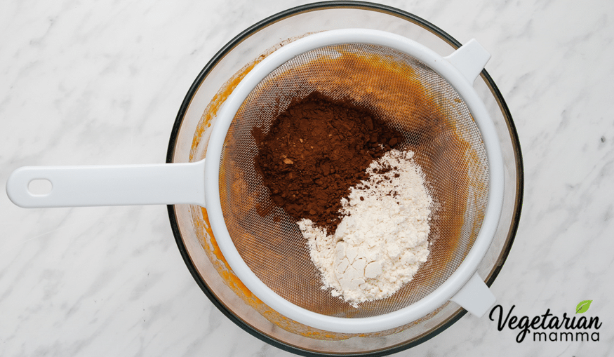Sieve the gluten-free flour and cocoa powder into the mixture, then add the salt. Fold everything together.