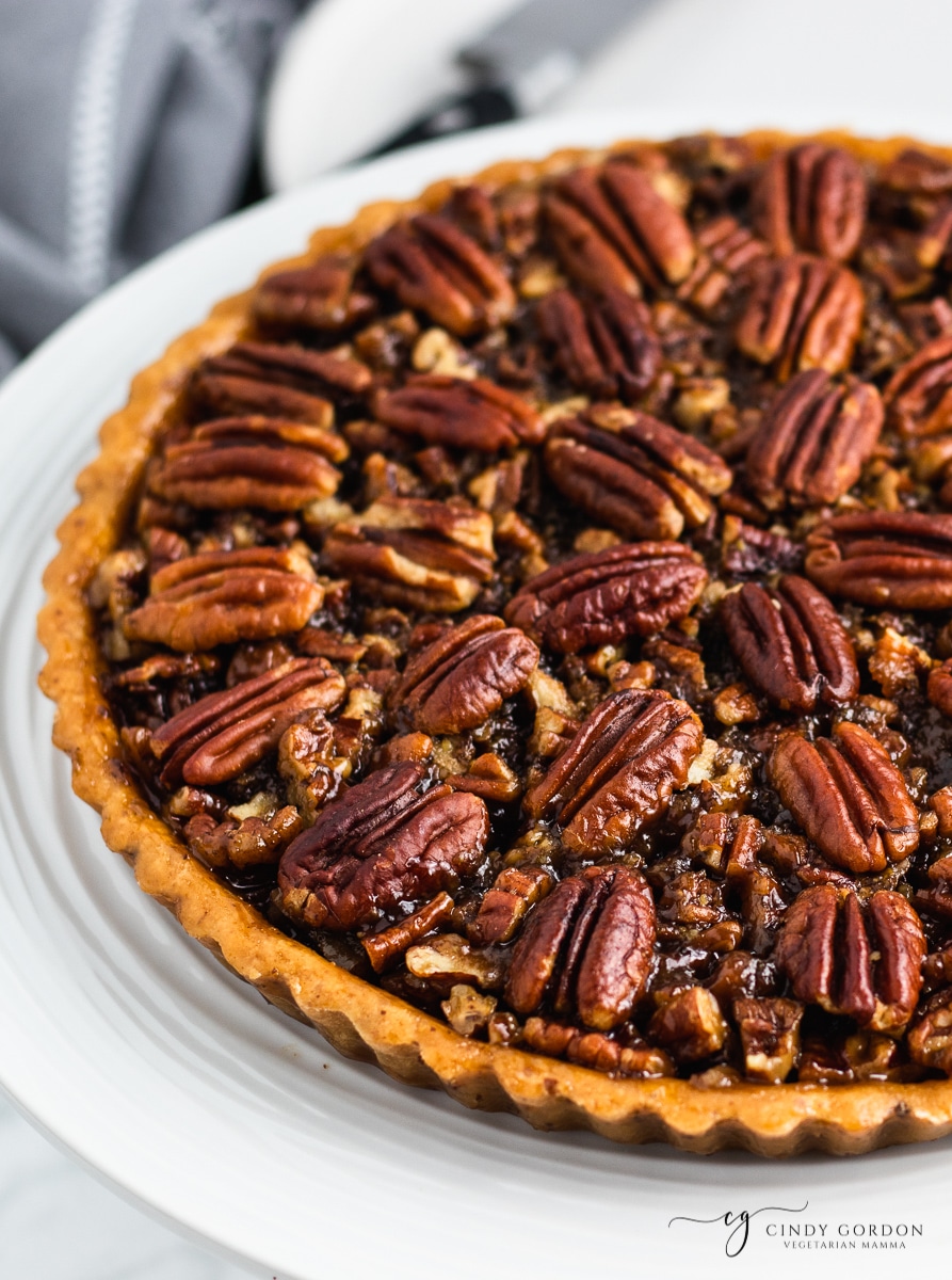 Close-up shot of a pecan pie decorated with whole pecans