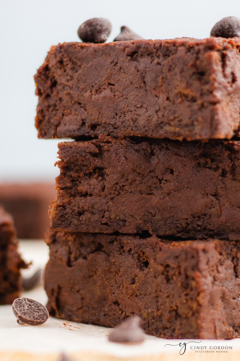 Close-up shot of 3 moist chocolate chip brownies in a stack