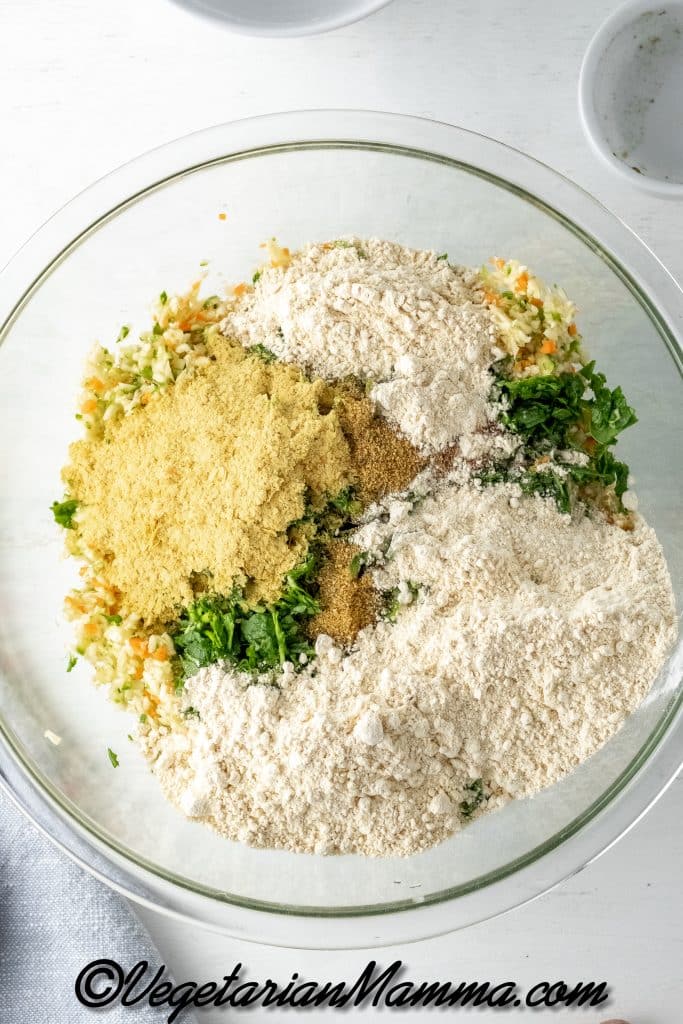 In a large mixing bowl, mix the blended zucchini and carrots with all other fritter ingredients. Mix well.