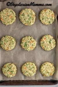 Make the fritters by rolling ¼ cup of zucchini mixture into a ball. Flatten ball with your hand on baking sheet covered in parchment paper.