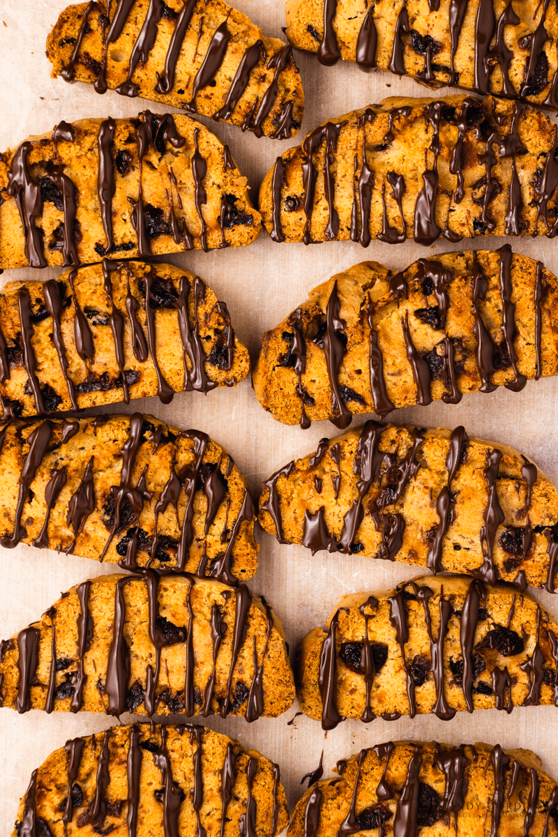 A dozen vegan biscotti drizzled with chocolate