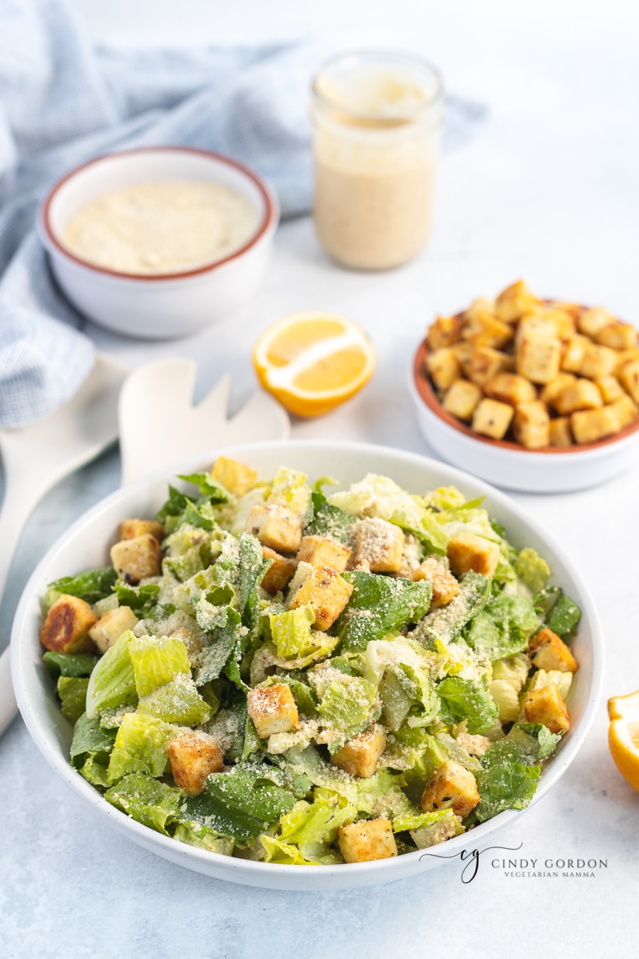Overhead shot of a vegan Caesar salad in a round white bowl