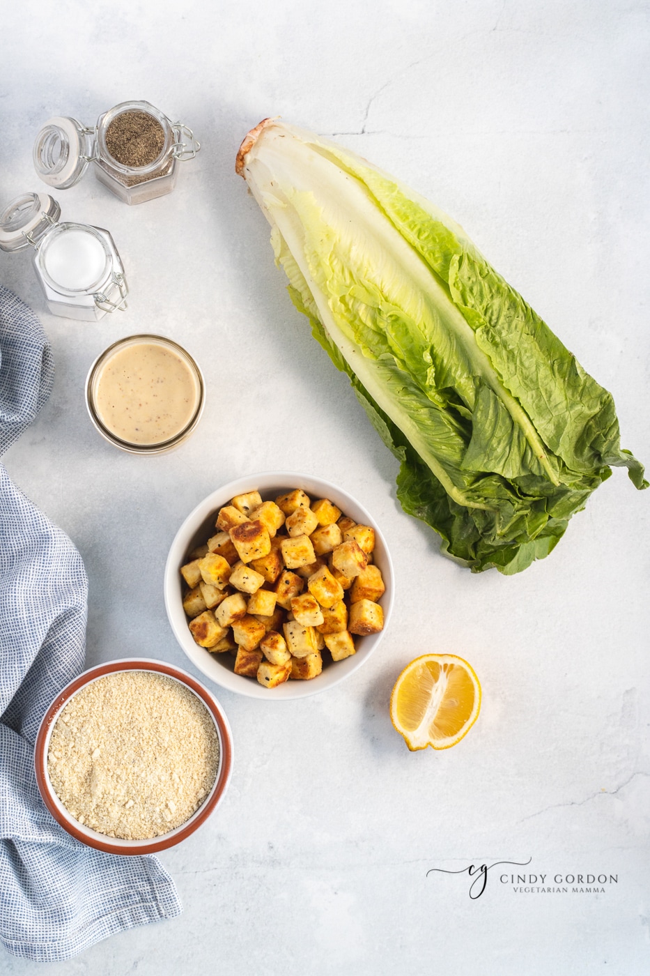 Romaine lettuce, vegan Caesar dressing, tofu croutons, vegan Parmesan cheese, salt and pepper