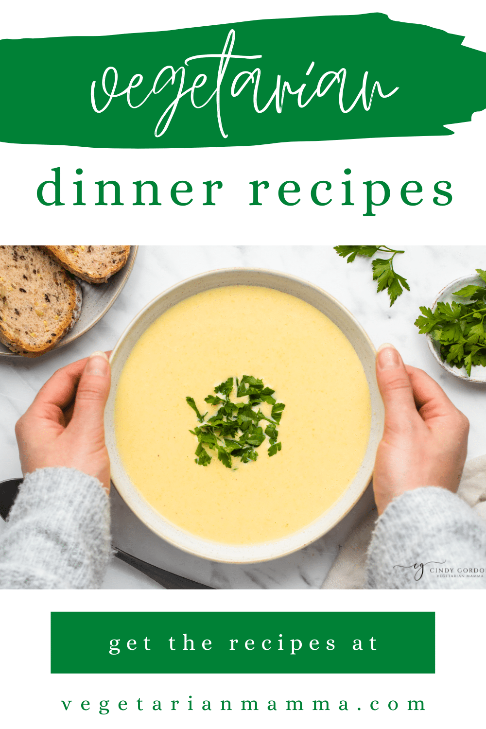 text overlay: 17+ vegetarian dinner recipes hands on each side of a white bowl filled with yellow liquid and green herbs on top