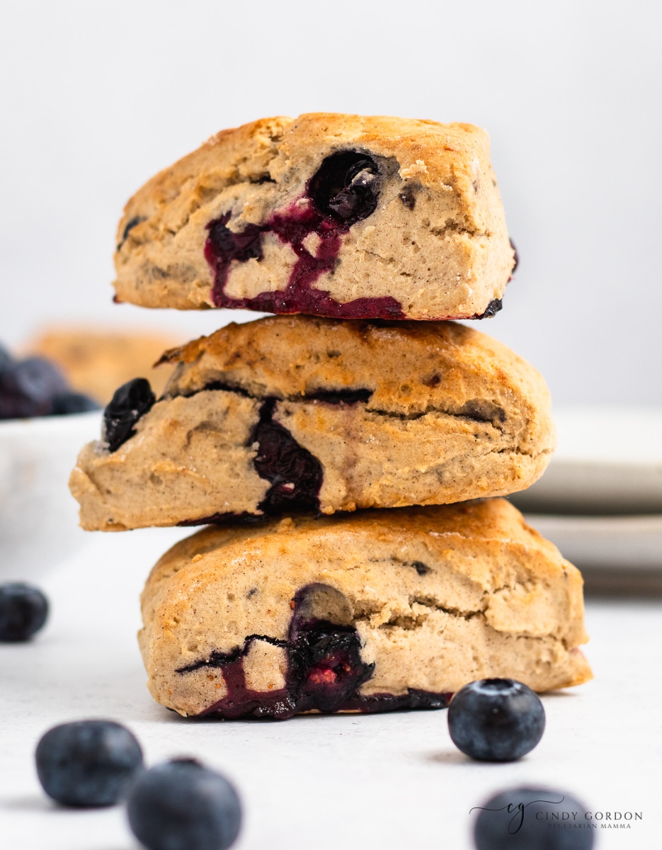 A stack of three fluffy vegan blueberry scones.