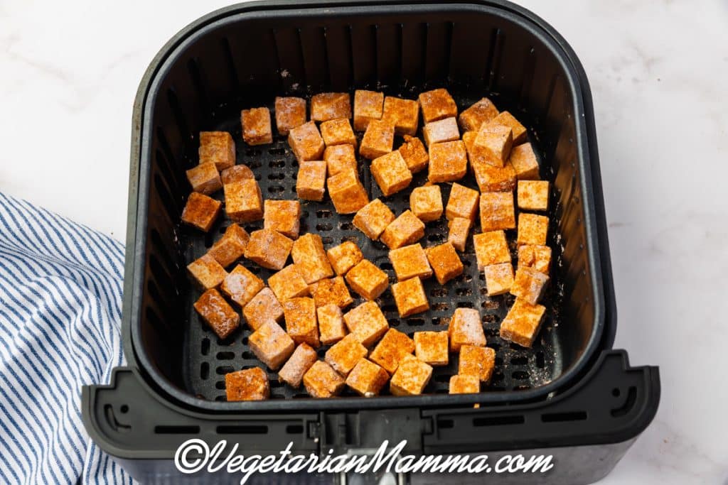 Season with salt and pepper. Put into Air Fryer basket.