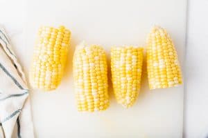 two ears of corn cut in half to make four pieces