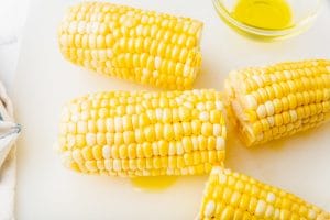 4 mini ears of corn with oil