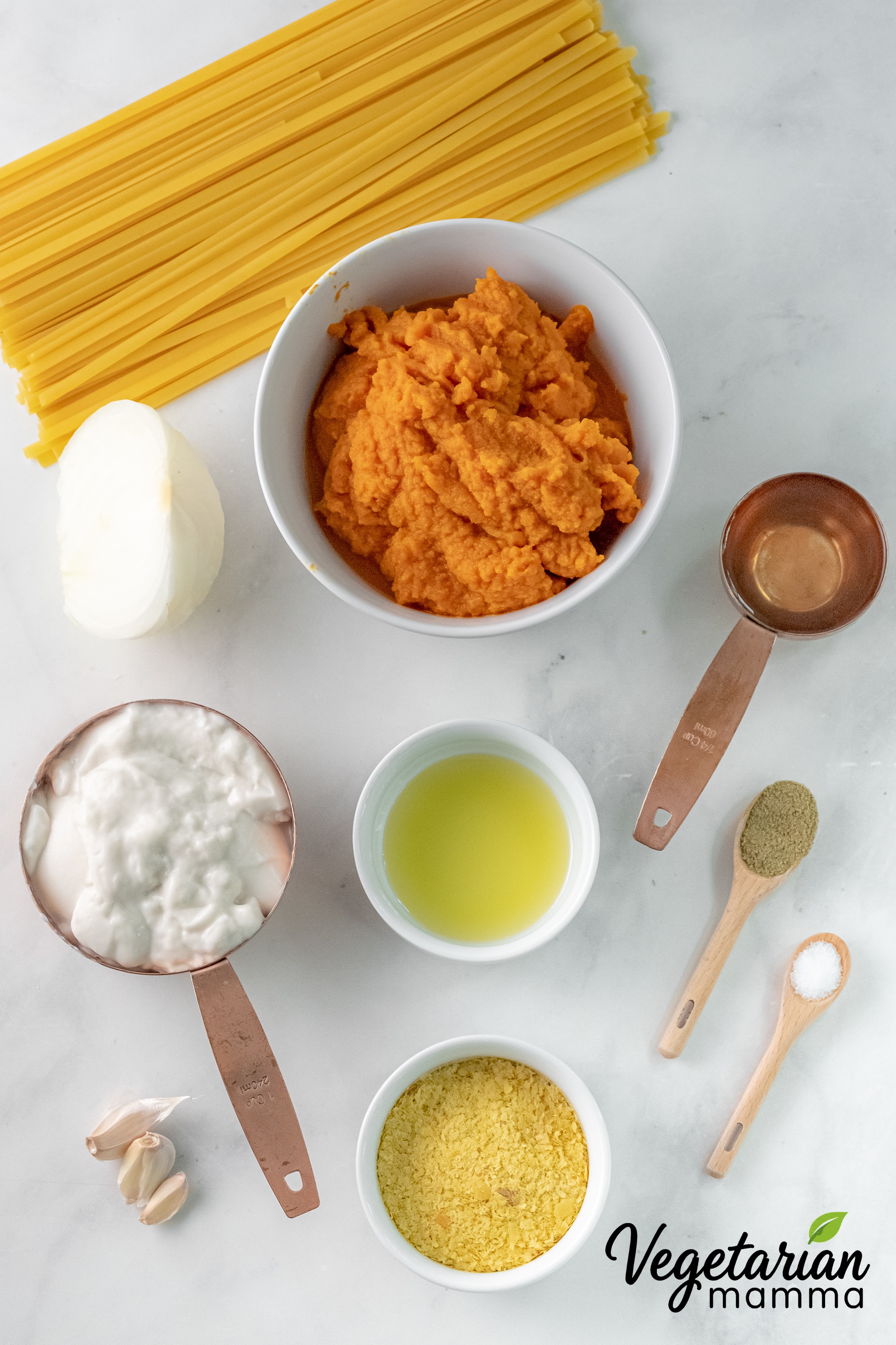 Ingredients for vegan pumpkin pasta arranged on a counter