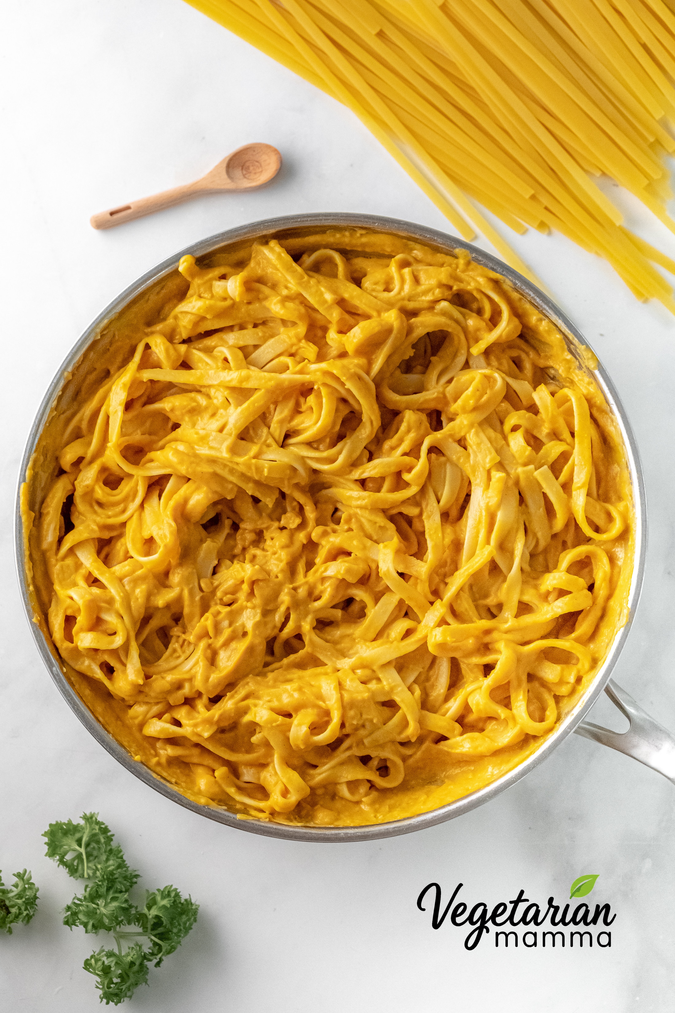 vegan pumpkin alfredo image with text overlay for social media