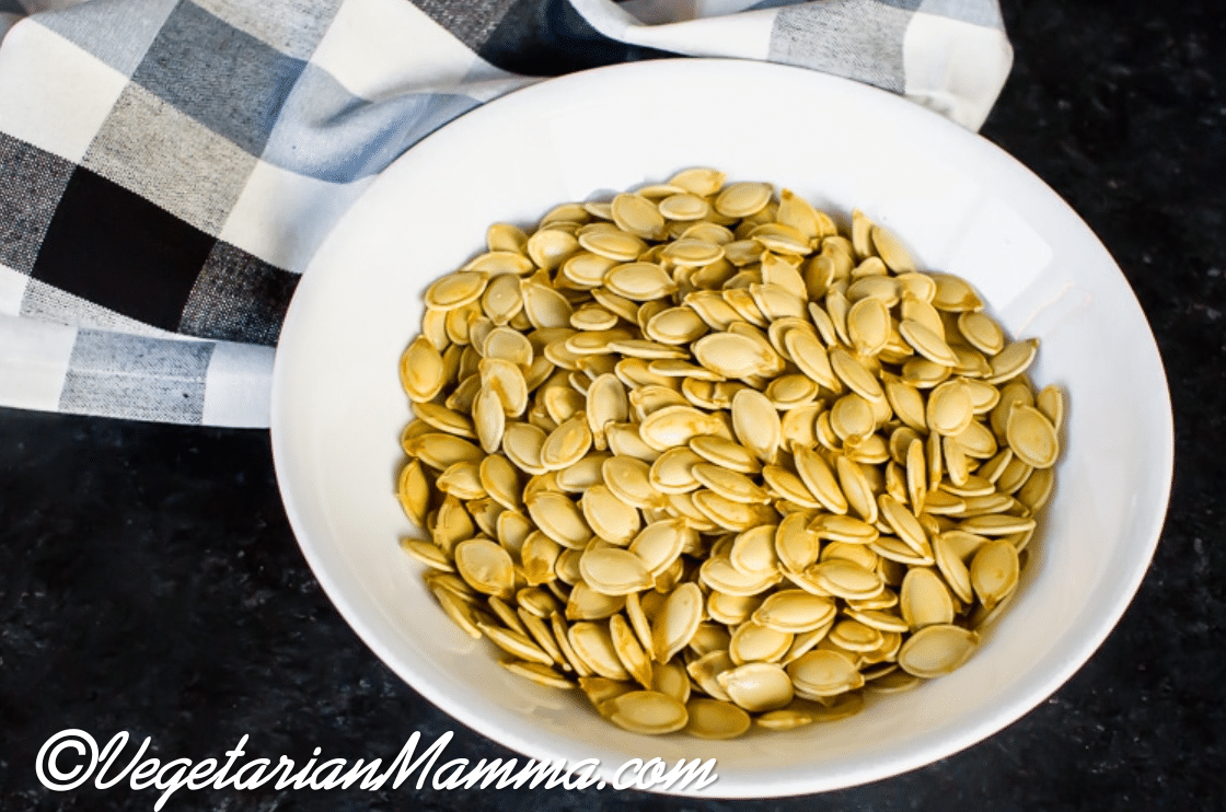 Air Fryer Pumpkin Seeds in a white bowl.