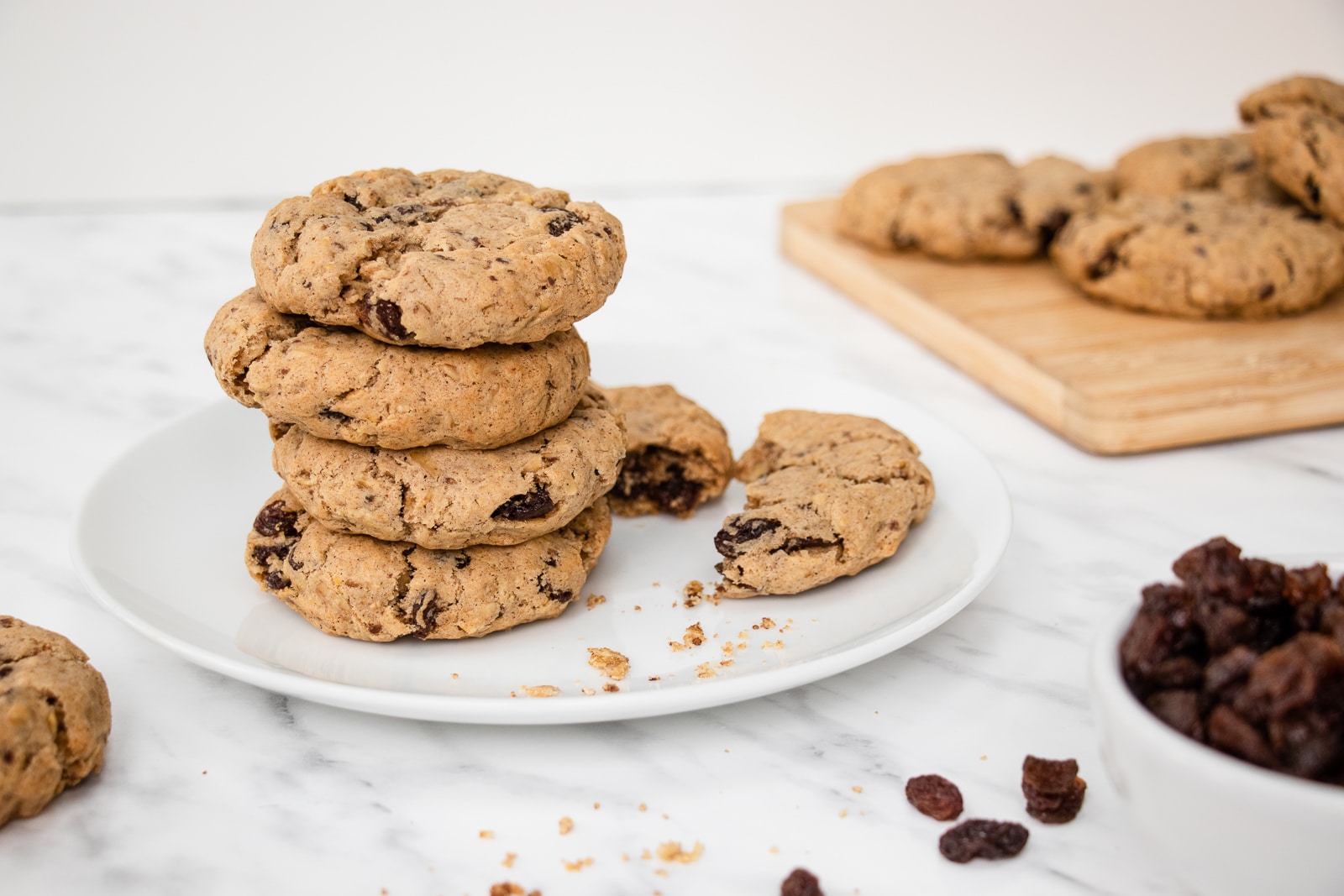 vegan oatmeal raisin cookies - brown fluffy cookies with dark brown raisins