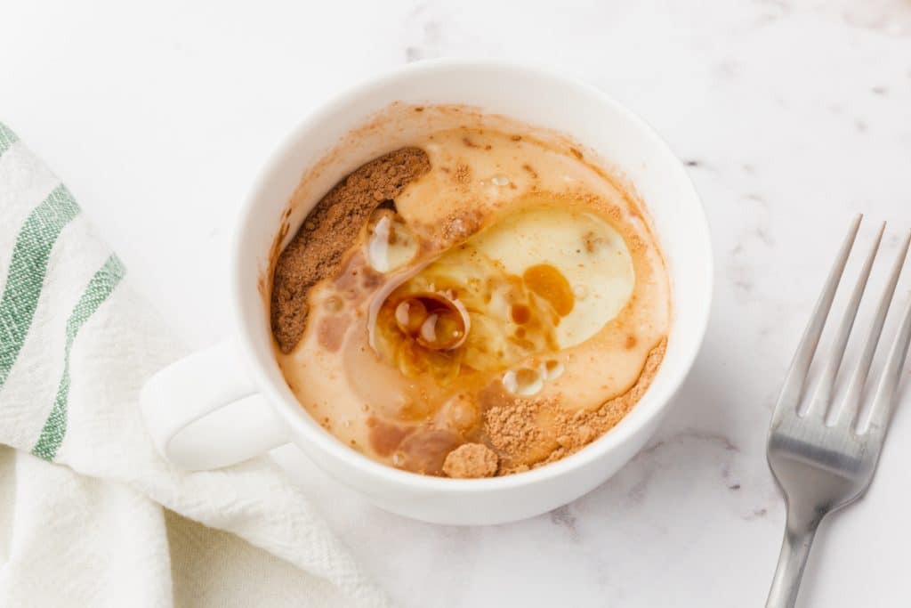 white bowl with vegetable oil, almond milk, and vanilla extract