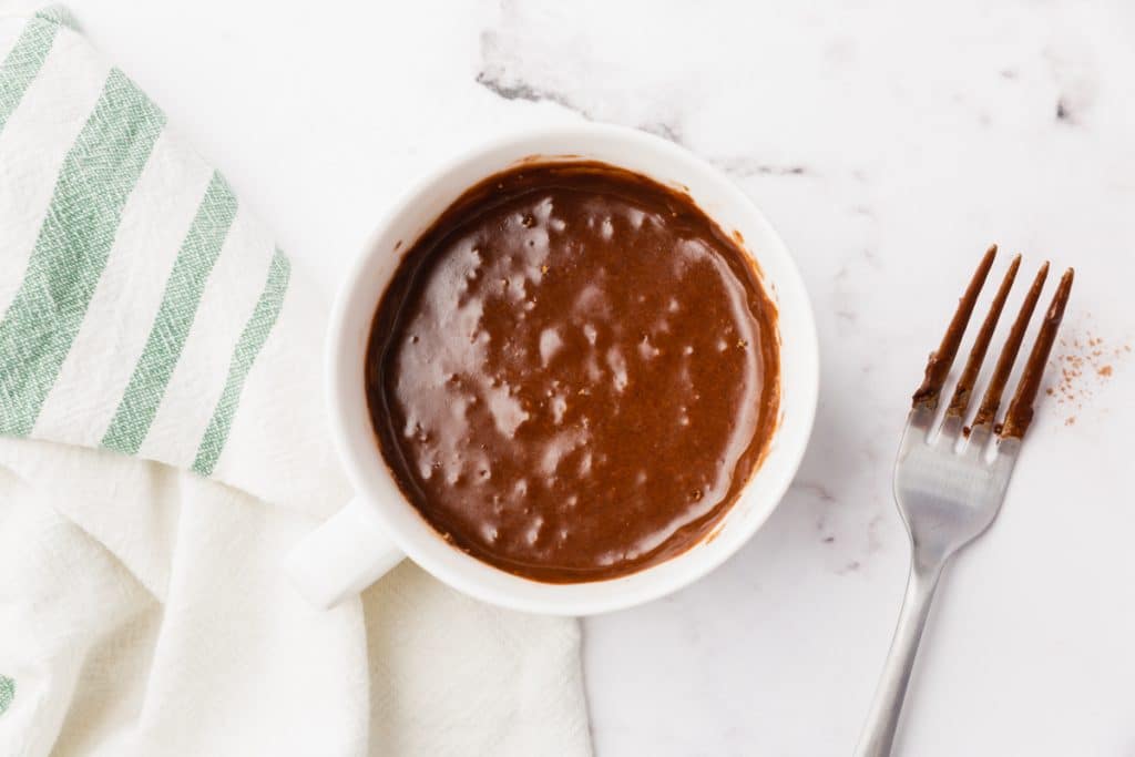 white bowl with vegan brownie mug uncooked
