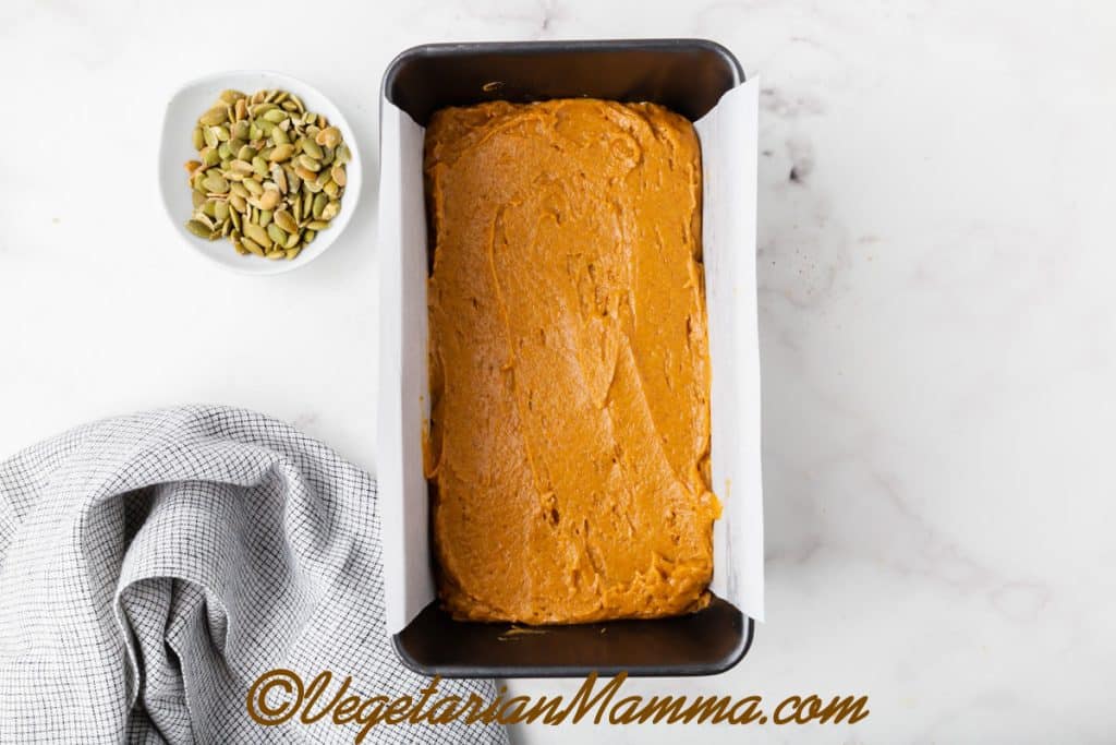 Pour the batter into the prepared loaf pan.