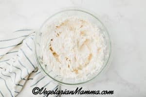 add the vegan cream cheese. Beat with an electric mixer until soft and creamy, 2-3 minutes.