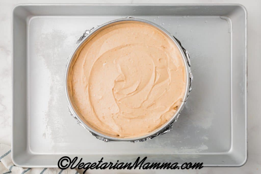 Place the springform pan in a deep baking dish.