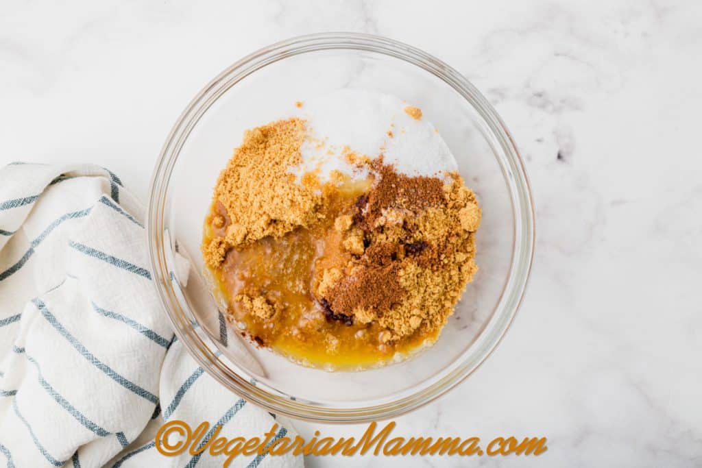 In a medium bowl, combine the graham cracker crumbs, melted vegan butter, granulated sugar, and pumpkin spice.