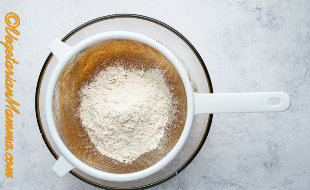 Sieve flour mixture into wet ingredients, and mix everything together.