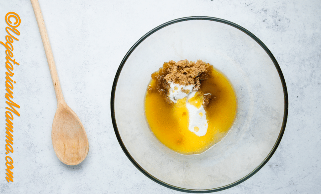 Add melted butter, brown sugar, and caster sugar to a mixing bowl.