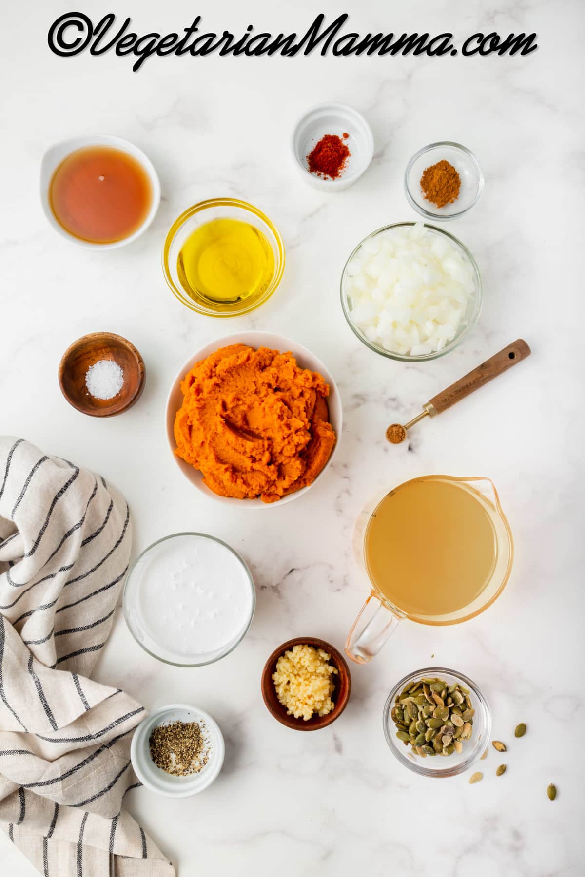 Bowls of pumpkin puree, onion, oil, paprika, nutmeg, salt, cinnamon, and vegetable broth