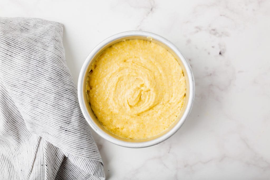 yelllow liquid and flour mixed together and put into a round metal continer