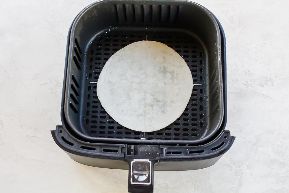 Air Fryer Quesadilla in a black air fryer basket