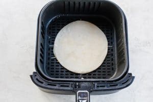 Air Fryer Quesadilla in a black air fryer basket