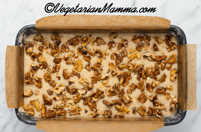 transfer all ingredients into a parchment paper lined pan and top with walnuts