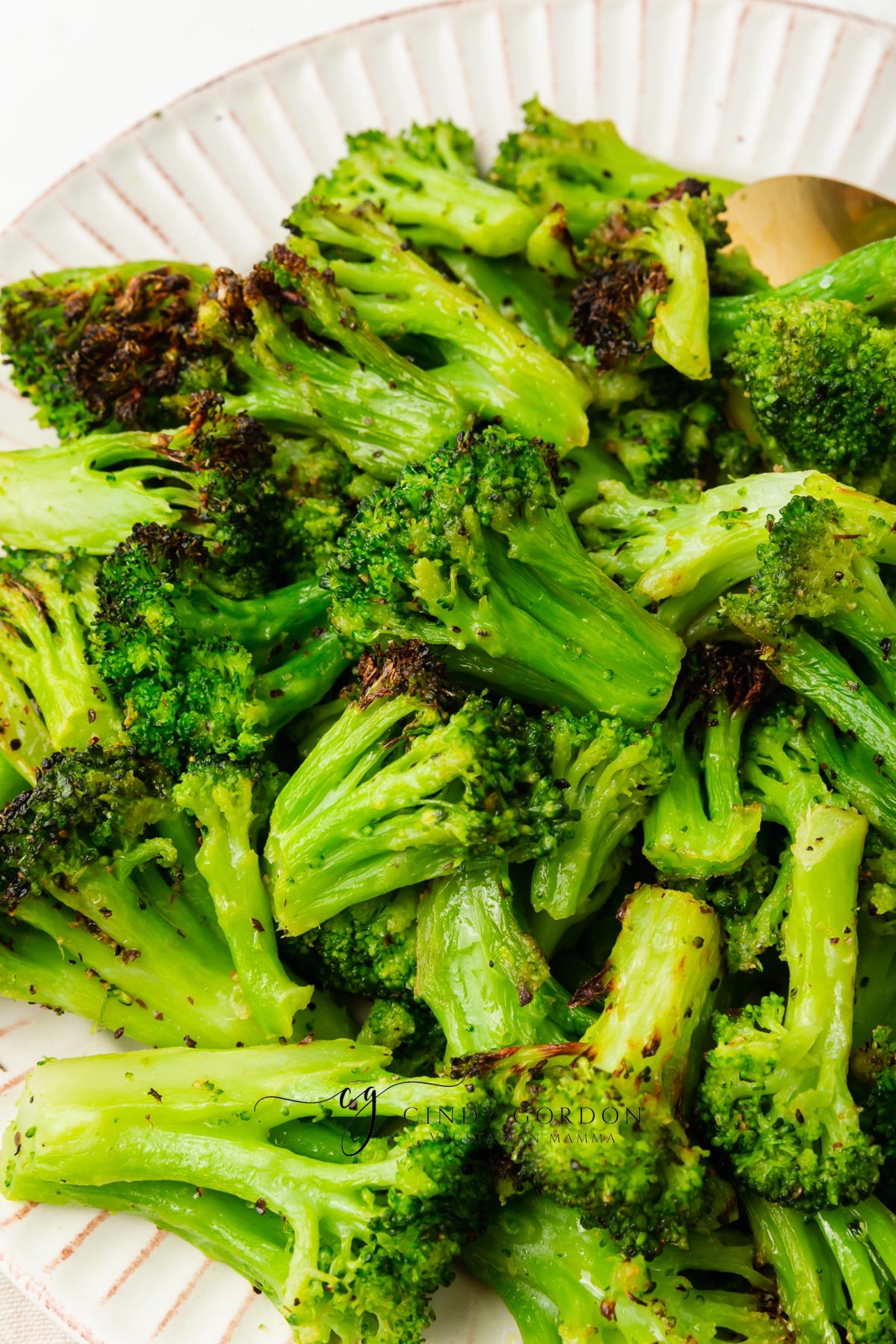 air fryer frozen broccoli on white plate