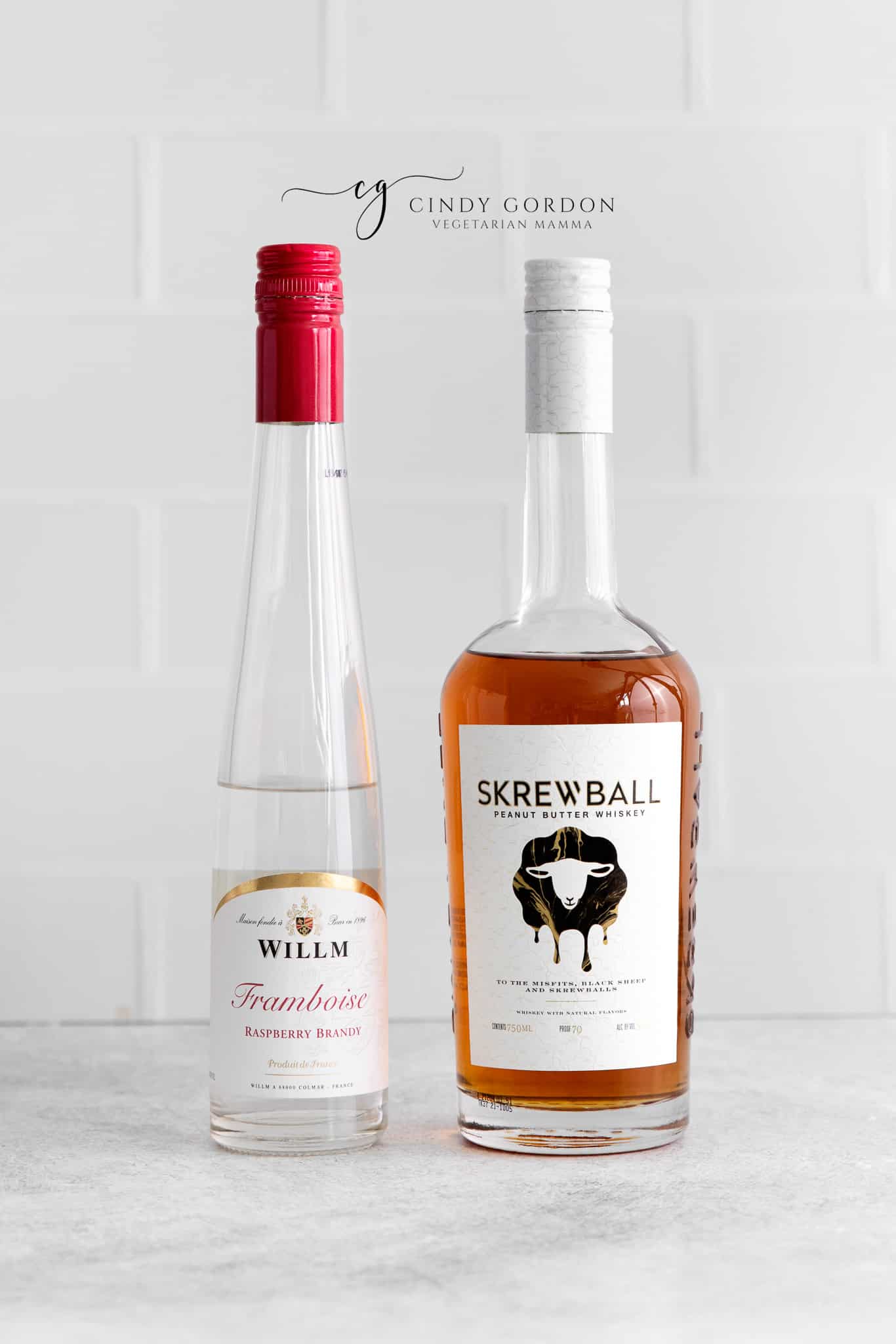 bottles of berry liqueur and screwball whisky.