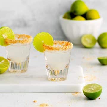 key lime pie shot in a glass with key lime wedge