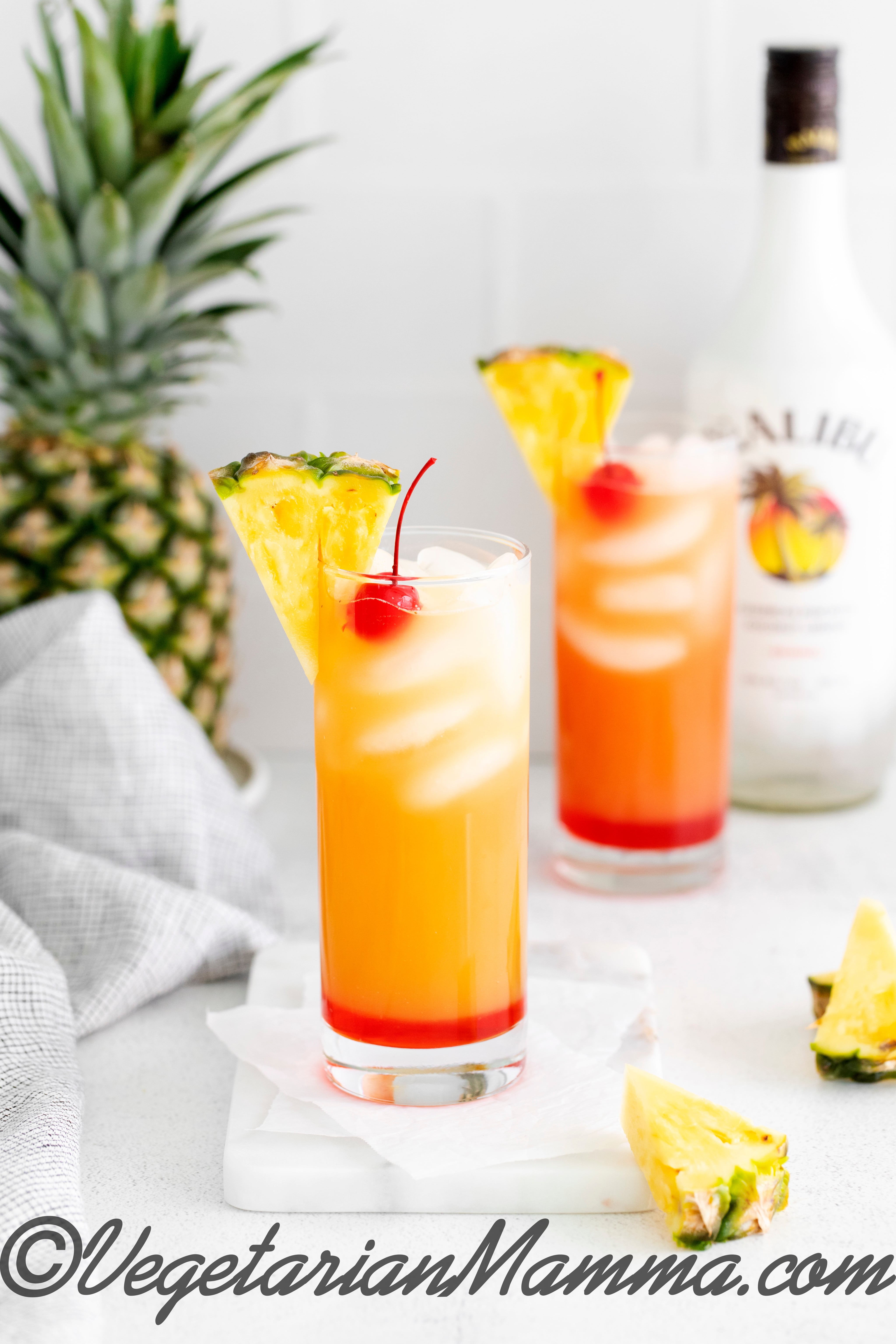 malibu rum drink with pineapple and cherry